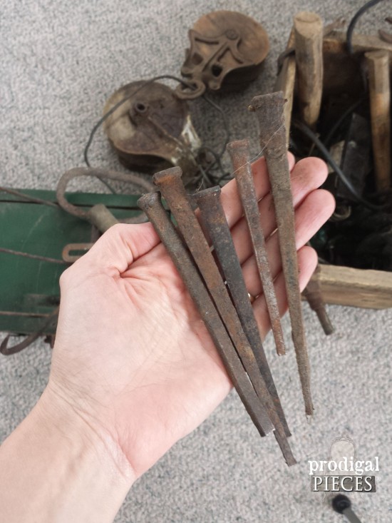 Rusty Hand-Forged Nails for Coat Rack in Farmhouse Bedroom | prodigalpieces.com
